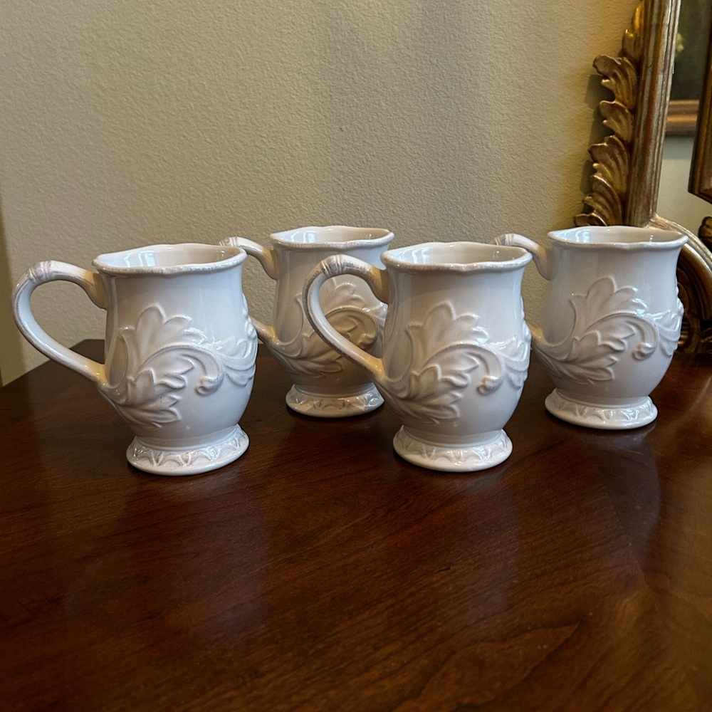 Set is 4 Certified International ivory color mugs
